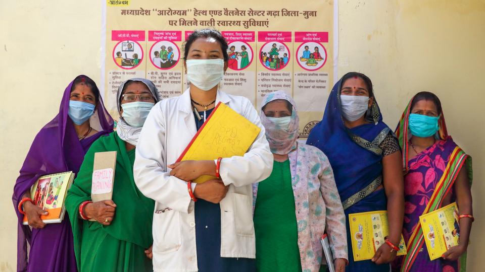 A community health officer stands in front of a team of primary health care workers supported by the USAID-funded, Jhpiego-led NISHTHA project in India in February of 2021. Photo Credit: Soumi Das