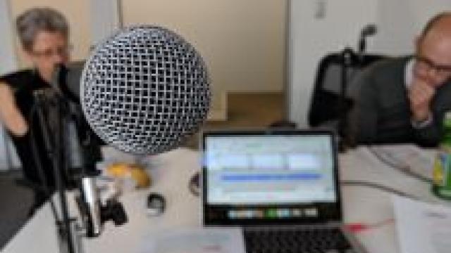Microphone and laptop in podcast studio