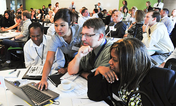 Participants at USAID Forward Summit use computers