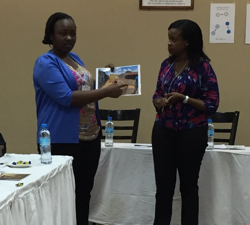 Two women present during the K4Health Share Fair