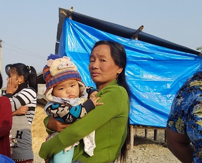 An internally displaced woman and her baby living in a flood-affected community of Itahari, Nepal/ Sarah Swift, USAID