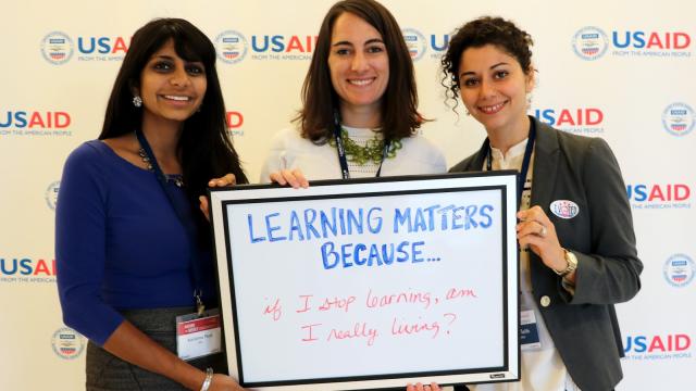 Image of person holding "Learning Matters because..." sign